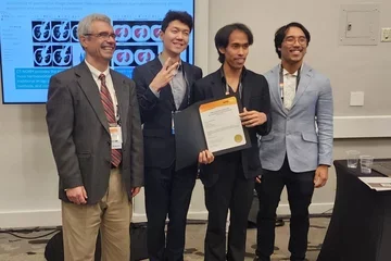 Wasil Wahi-Anwar, Jin Kim, and Dallas Tada presented award.