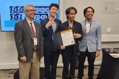 Wasil Wahi-Anwar, Jin Kim, and Dallas Tada presented award.