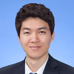 jin kim in a suit with blue striped tie