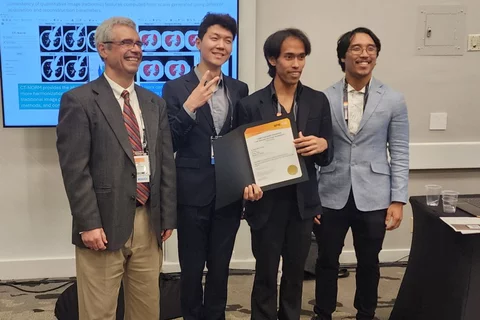 Wasil Wahi-Anwar, Jin Kim, and Dallas Tada presented award.